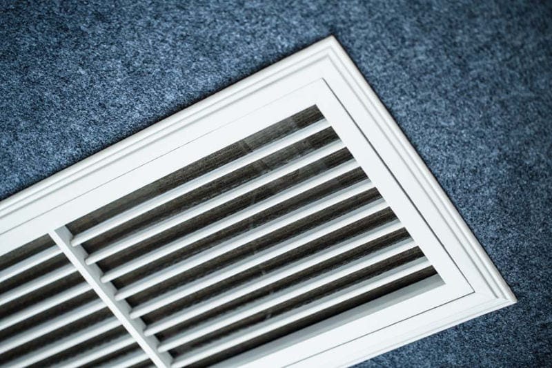 Close-up of floor vent to represent information on AC terms and definitions.