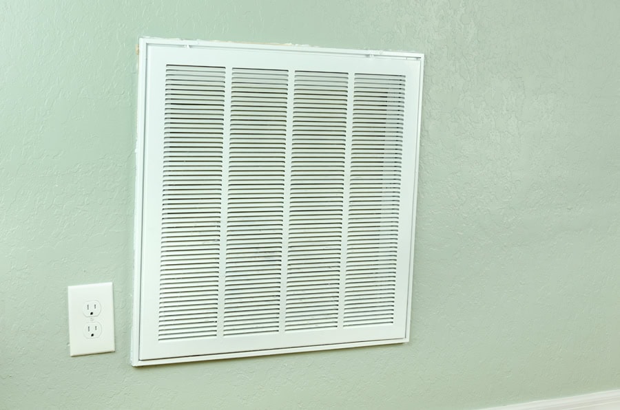Vent on wall to represent air handler maintenance in Sudbury, MA, home.