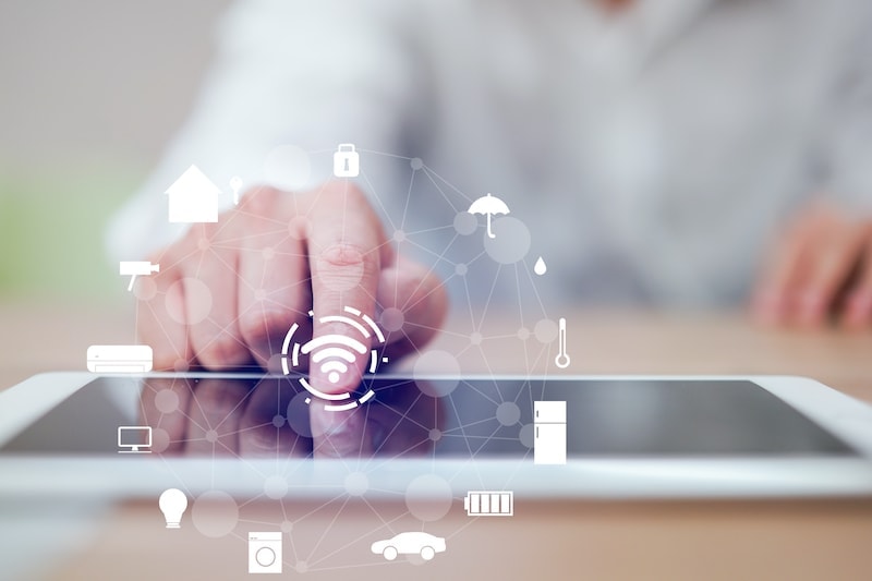 close up man hand press on display screen tablet turn on wifi technology for using home automation function to looking inside or outside home and property