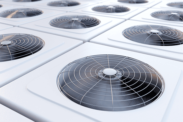 Several air conditioning units together to represent info on the difference between single-stage and variable-speed ACs.