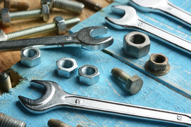 HVAC maintenance tools sitting on wooden table.