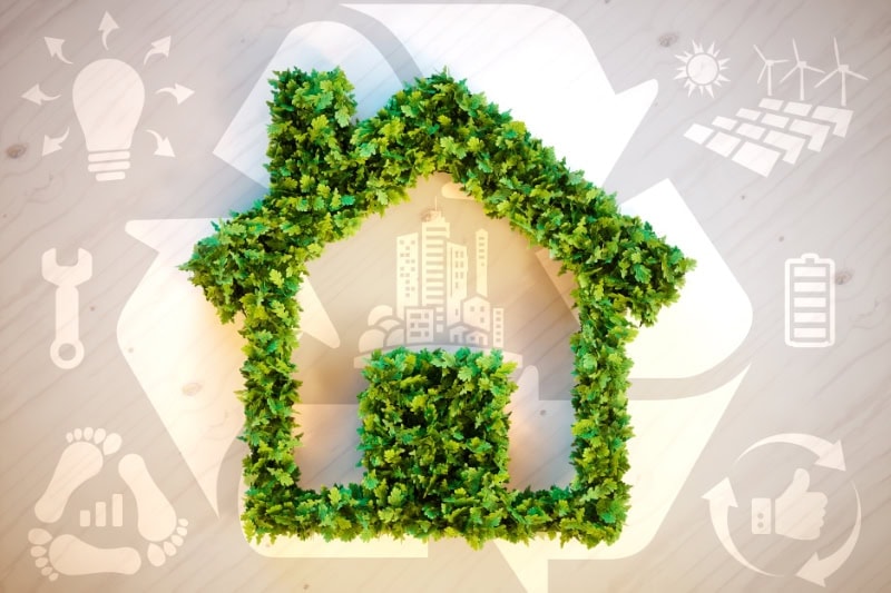 Decorative home made of leaves with lighting underneath to represent tips on preparing your Marlborough home for vacation.