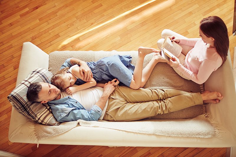Family relaxing on couch